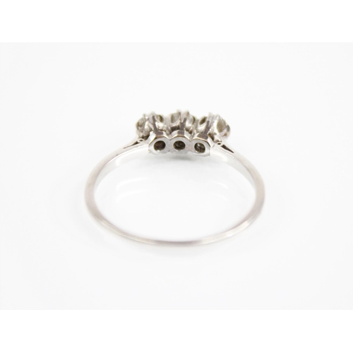 168 - An Art Deco three stone diamond ring, the central old cut diamond measuring approximately 4.2mm x 3.... 