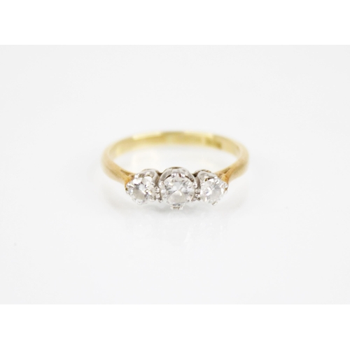 169 - An early 20th century three stone diamond ring, the central round transitional cut circular diamond ... 