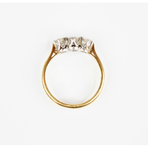 169 - An early 20th century three stone diamond ring, the central round transitional cut circular diamond ... 