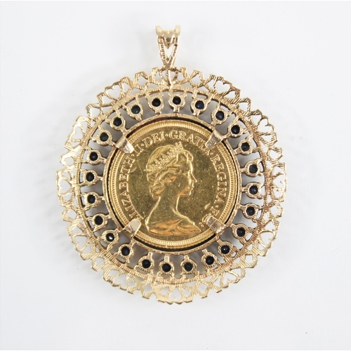 188 - An Elizabeth II sovereign, dated 1980, within a 9ct gold sapphire set pendant mount, the mount set w... 