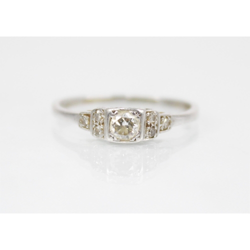 191 - A mid-20th century diamond ring, the central brilliant cut diamond weighing approximately 0.15 carat... 