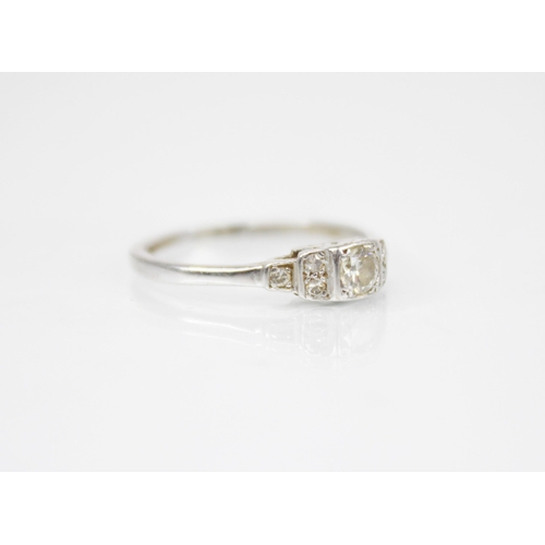 191 - A mid-20th century diamond ring, the central brilliant cut diamond weighing approximately 0.15 carat... 