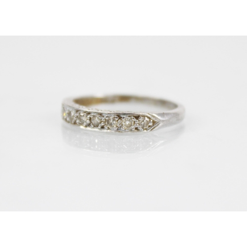 192 - A mid-20th century diamond half eternity ring, with nine round mixed cut diamonds set in a white met... 