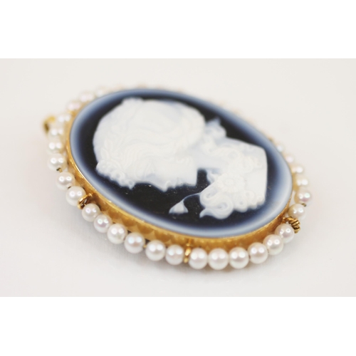 200 - A cameo brooch/pendant, the carved oval cameo depicting a young lady facing sinister, mounted in a p... 