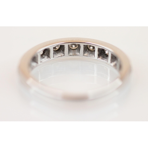 211 - A diamond set 18ct white gold half eternity ring, the nine round cut diamonds, measuring between 1.7... 