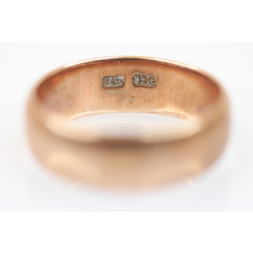 213 - A yellow metal wedding band, stamped to interior '9ct', ring size T 1/2, weight 6.3gms