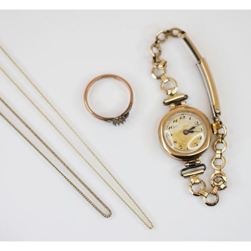 216 - A ladies 9ct gold wristwatch, the circular cream dial with engine turned detail and Arabic numerals,... 