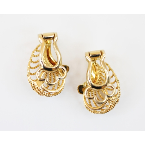 221 - A pair of gold coloured clip-on earrings, of curved pierced form with rope twist detail, clip-on fas... 