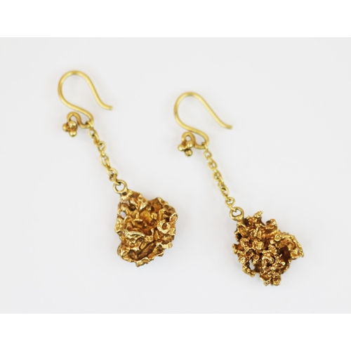 226 - A pair of gold coloured nugget drop earrings, the droppers of organic nugget form, suspended upon a ... 