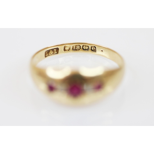 229 - An Edwardian 18ct gold untested ruby and diamond set ring, the central round mixed cut ruby measurin... 