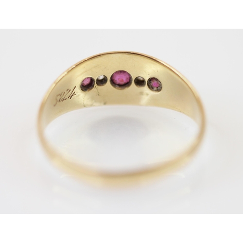 229 - An Edwardian 18ct gold untested ruby and diamond set ring, the central round mixed cut ruby measurin... 