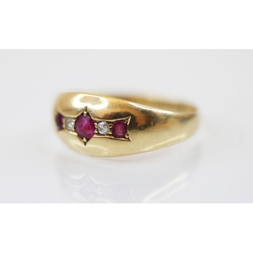 229 - An Edwardian 18ct gold untested ruby and diamond set ring, the central round mixed cut ruby measurin... 