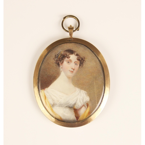 275 - English school (late 18th/early 19th century),  
A half length portrait miniature depicting a young ... 