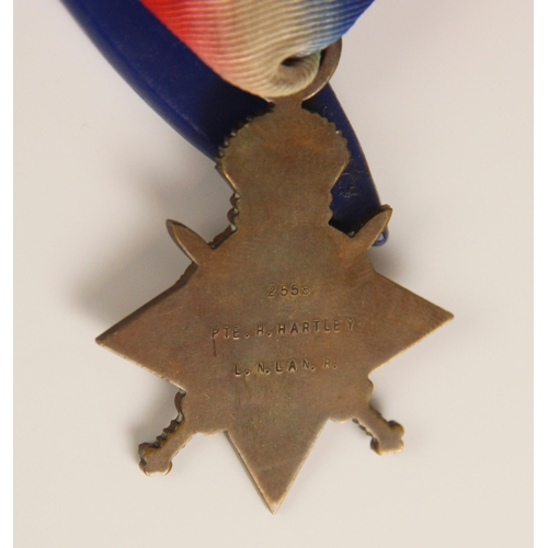 284 - A World War I trio medal group to 2558 Private H Hartley, The Loyal Regiment (North Lancashire), com... 