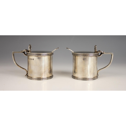 39 - A pair of George V silver wet mustards, Jones & Son, London 1935, of cylindrical form with reeded bo... 