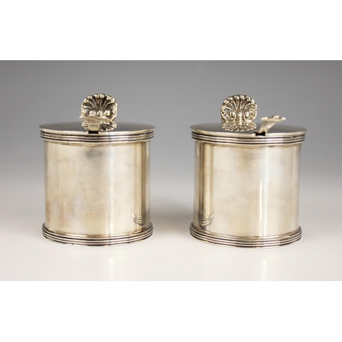 39 - A pair of George V silver wet mustards, Jones & Son, London 1935, of cylindrical form with reeded bo... 