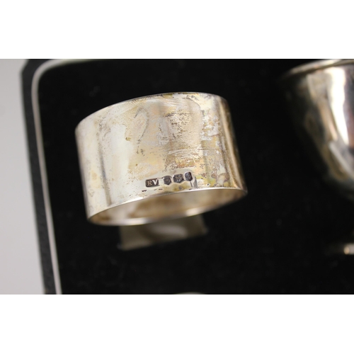 40 - A cased silver christening set, Emile Viner, Sheffield 1957-58, comprising egg cup, napkin ring and ... 