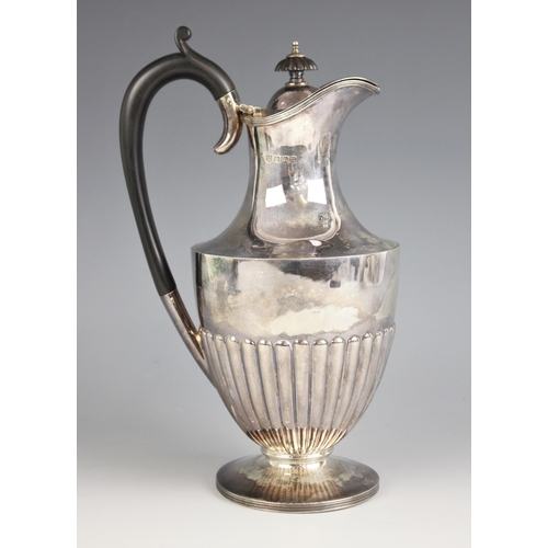 50 - An Edwardian silver ewer, Cooper Brothers and Sons, Sheffield 1904, of shouldered baluster form with... 