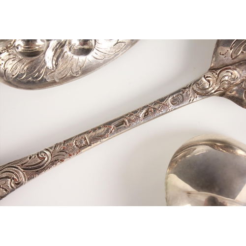 52 - A pair of George I silver Hanovarian pattern spoons, stamped ‘IS’, London 1724, the bowls with later... 