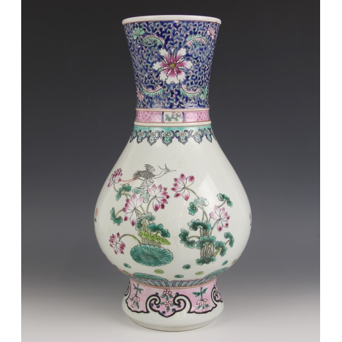 572 - A Chinese porcelain famille rose 'Peacock' vase, Kangxi six character mark, painted with two peacock... 