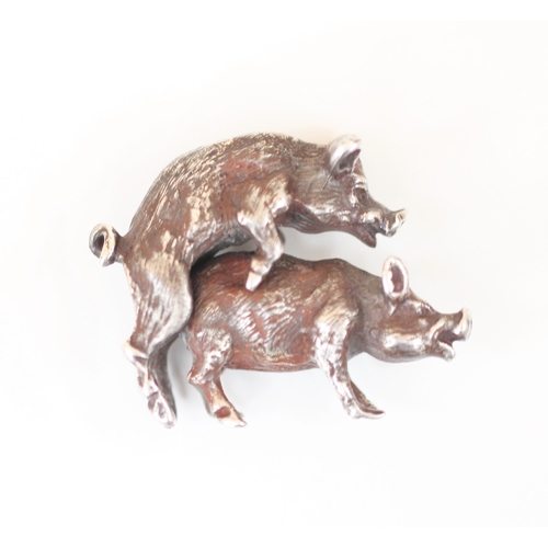 58 - An early 20th century Russian silver model of two mounted pigs, modelled realistically with fur effe... 