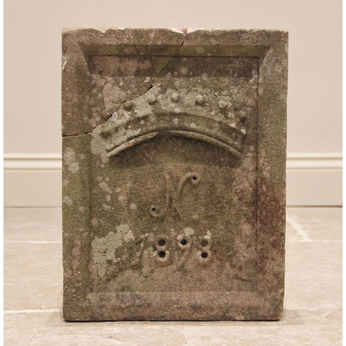 590 - A late 19th century sandstone date block, of rectangular form with raised rim, carved in relief with... 