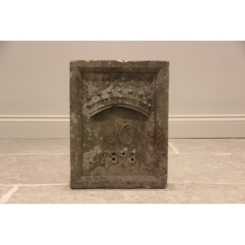 590 - A late 19th century sandstone date block, of rectangular form with raised rim, carved in relief with... 