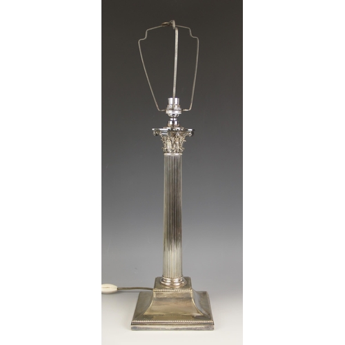 676 - A silver plated Corinthian column lamp base, of typical fluted form, the column extending to an inte... 