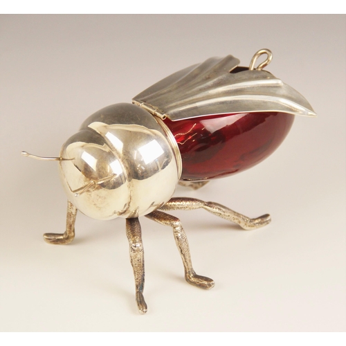 69 - A 20th century silver plated and cranberry glass novelty preserve pot, modelled as a honey bee with ... 