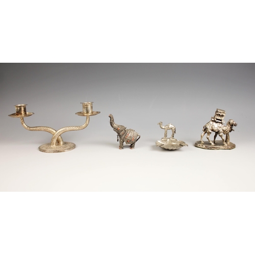 74 - A selection of silver coloured items, to include a two branch candleabra (weighted) the branches wit... 