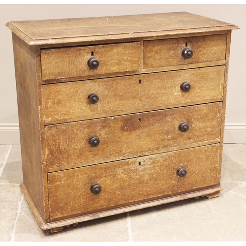 828 - A 19th century scumbled pine chest of drawers, the rectangular moulded top over two short and three ... 