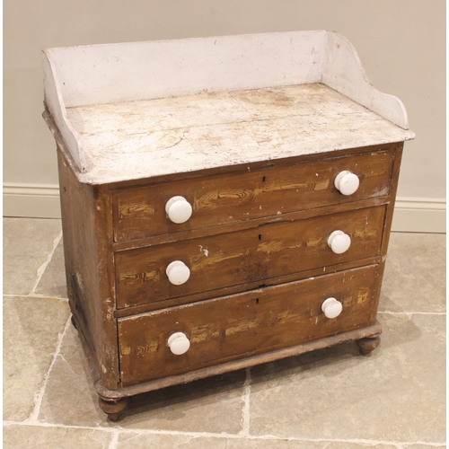 830 - A Victorian scumbled pine chest of drawers, the painted tray top above an arrangement of three long ... 