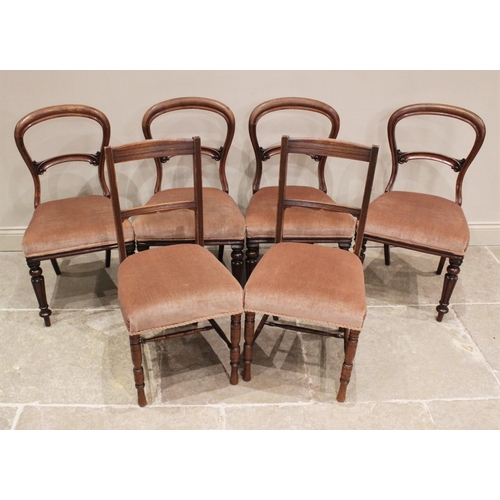 836 - A set of four Victorian mahogany balloon back dining chairs, each with a stuff-over seat, upon lobed... 