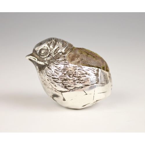 84 - An early 20th century silver pin cushion, probably Sampson Mordan (marks worn), modelled as a hatchl... 