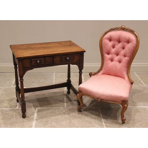 849 - An oak side table, early 20th century, the rectangular top over a pair of frieze drawers applied wit... 