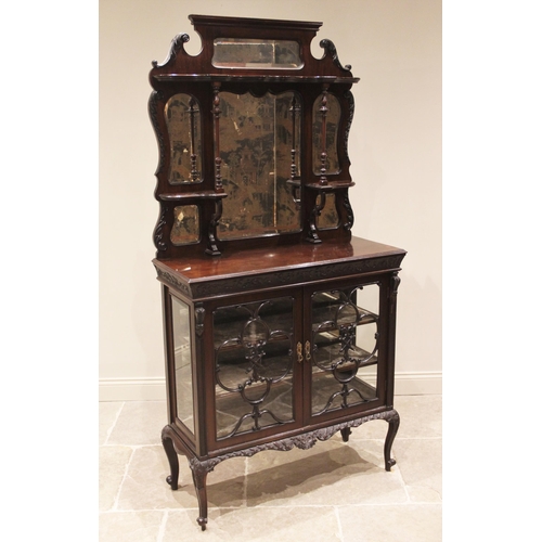 859 - An Edwardian mahogany mirror back chiffonier, the shaped back with a swan neck pediment over an arra... 