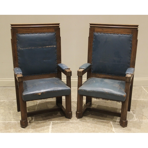 865 - A pair of teak and leather magistrates court throne chairs, early 20th century, each with a moulded ... 