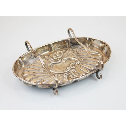 87 - A Victorian silver pen tray, Atkin Brothers, Birmingham 1892, of oval form with embossed decoration ... 