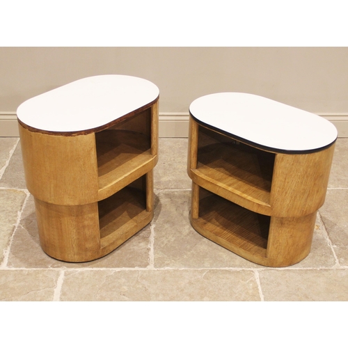 880 - A near pair of mid-20th century scumbled bedside/occasional tables, each of oval form with a Formica... 