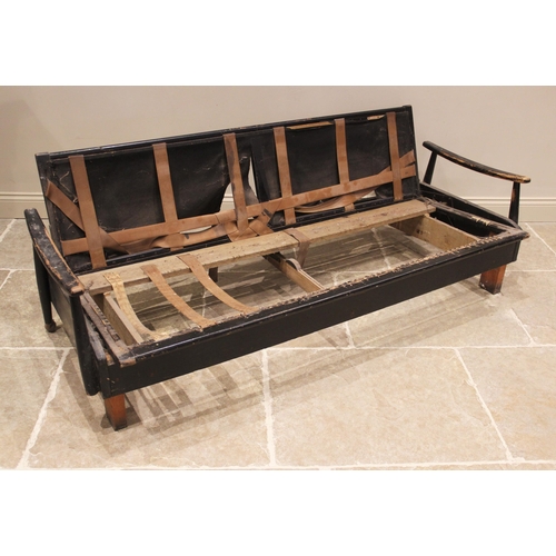 881 - A 1960’s ebonised daybed, possibly G-Plan, the rail back extending to down swept arms, 198cm wide (r... 