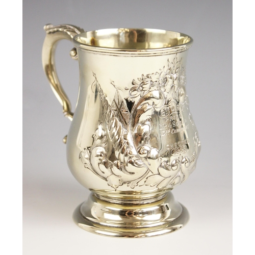 118 - A Victorian white metal military interest mug, of bell shape with scroll handle, engraved ‘6th C.R.V... 