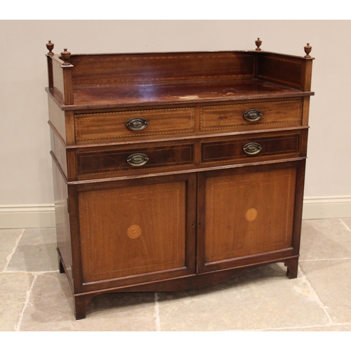 843 - An Edwardian mahogany and satinwood crossbanded washstand, the three quarter gallery with urn finial... 