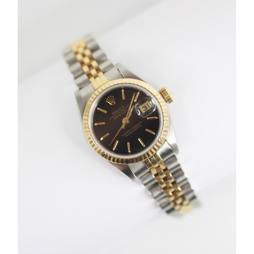 136 - A ladies bi-colour stainless steel Rolex Oyster-Perpetual Datejust wristwatch, the circular black di... 