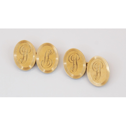 178 - A pair of 9ct gold cufflinks, designed as two oval discs joined by a curb link chain, monogrammed in... 