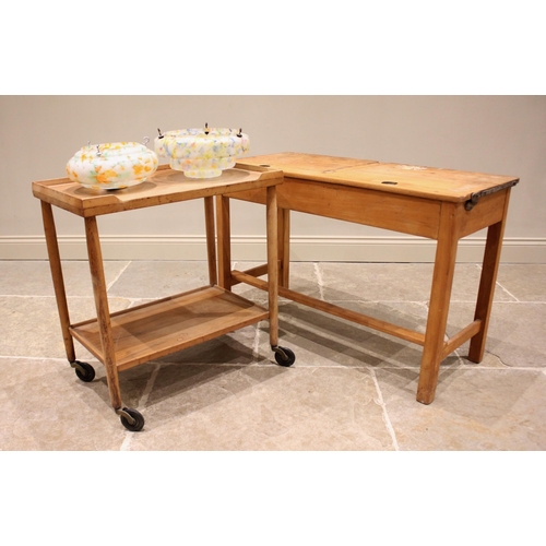 873 - A Danish inspired teak two tier drinks trolley by Kandya, mid 20th century, the two galleried tiers ... 