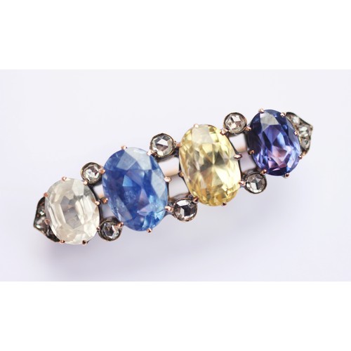 182 - An late 19th/early 20th century sapphire and diamond brooch, comprising a colourless sapphire (7.67 ... 