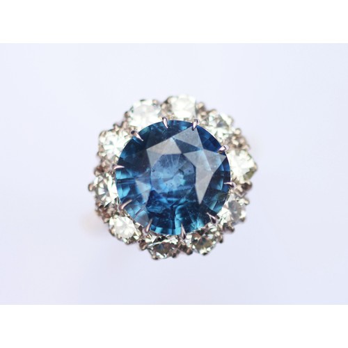 227 - A sapphire and diamond ring, the round cut sapphire weighing 5.10 carats approx. (10.7 x 10.7 x 6.0 ... 