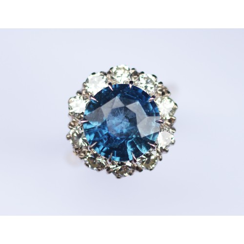 227 - A sapphire and diamond ring, the round cut sapphire weighing 5.10 carats approx. (10.7 x 10.7 x 6.0 ... 