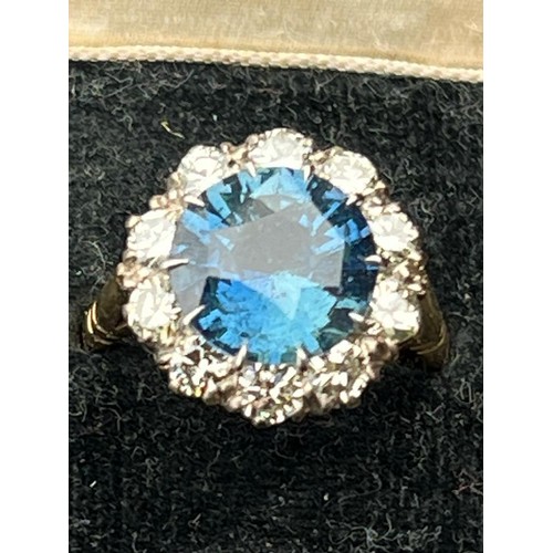 227 - A sapphire and diamond ring, the round cut sapphire weighing 5.10 carats approx. (10.7 x 10.7 x 6.0 ... 