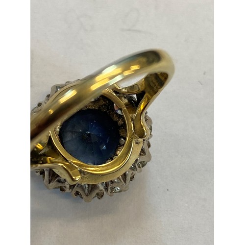 227 - A sapphire and diamond ring, the round cut sapphire weighing 5.10 carats approx. (10.7 x 10.7 x 6.0 ... 